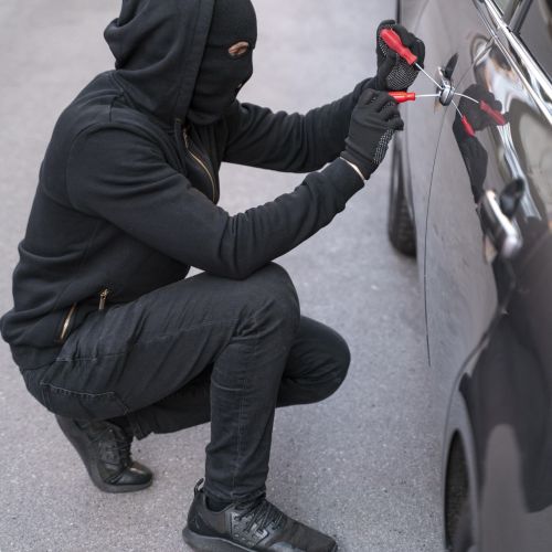 close-up-man-trying-break-into-car